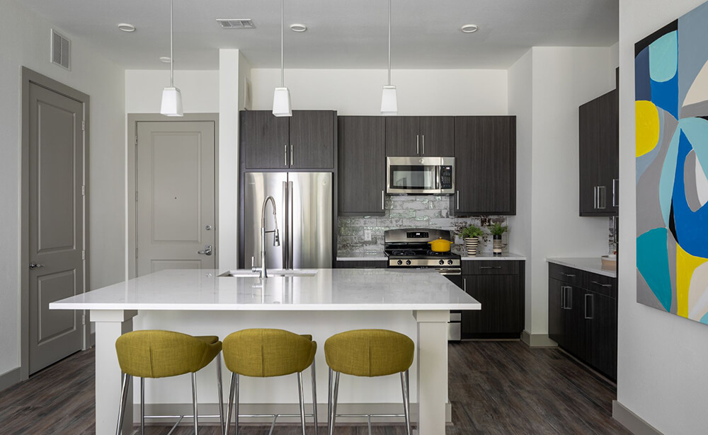 Broadstone summer street grey linen multi family kitchen cabinets with white quartz countertops